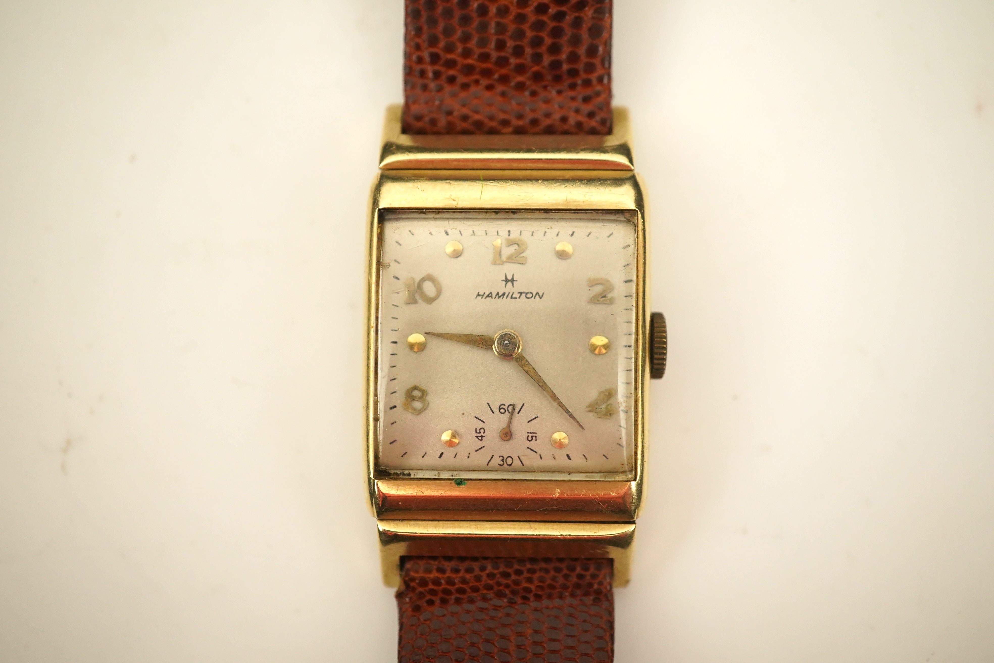 A gentleman's 1950's? 14k gold Hamilton manual wind wrist watch, on a later associated leather strap